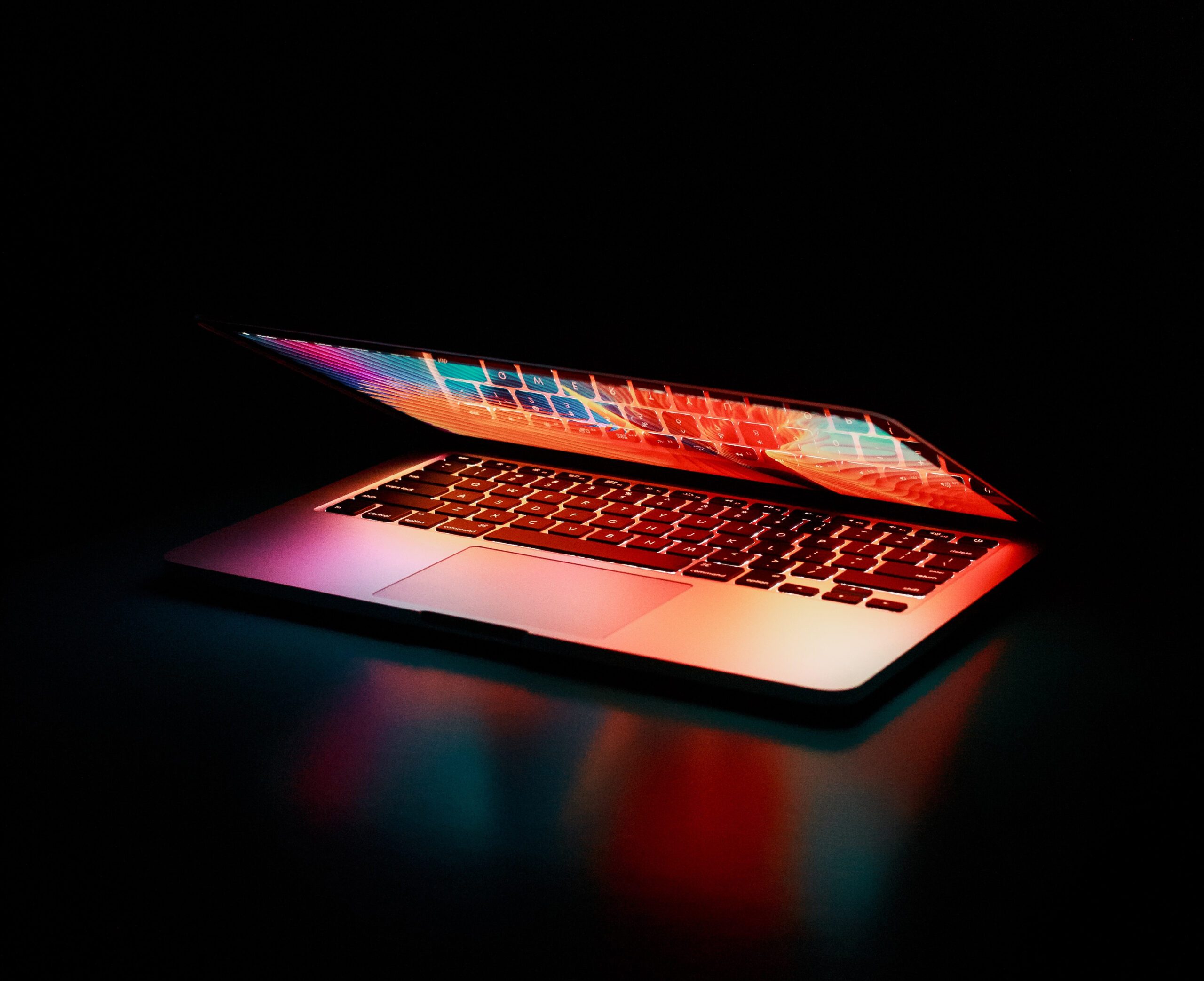Design creative work at a glowing laptop